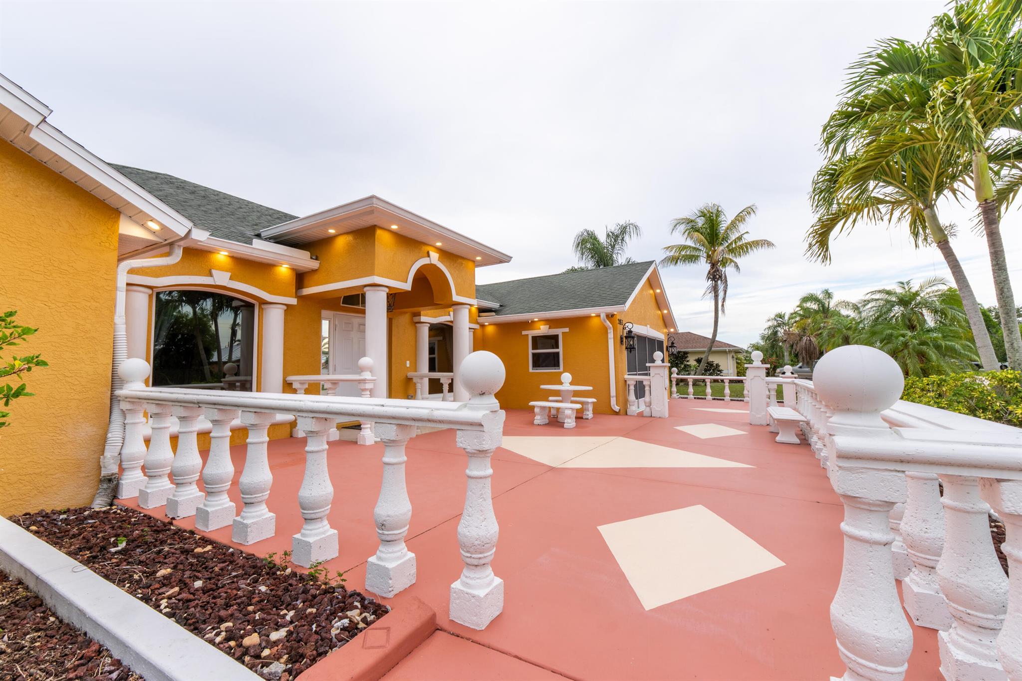 Luxury Coastal Living on 1/3 Acre with Dual Driveways & Designer Touches. Step into elegance with this stunning home nestled on an expansive 1/3-acre lot just 10 minutes from the beach. Featuring two private driveways and a spacious courtyard, this property is perfect for entertaining or accommodating boats and RVs with ease. Inside, you'll find a beautifully upgraded interior with soaring ceilings, upscale lighting, custom stonework, and detailed trim throughout. The home boasts two luxurious primary suites, a stylish cabana bath, and two expansive bay windows that flood the home with natural light. All windows are impact-rated for peace of mind. Whether you're looking for a spacious family retreat or a luxury Airbnb investment, this property delivers. Owner willing to rent also.