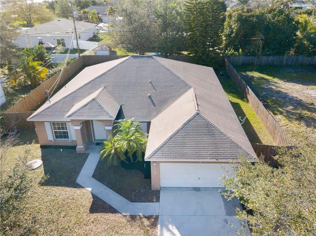 Photo of 3182 SW Cathedral Street, Port Saint Lucie, FL 34953 (MLS # R10780727)