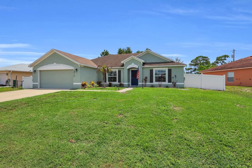 Welcome to 4215 SW Elba Street in Port St. Lucie's highly desirable Becker area, a beautifully maintained 4-bedroom, 2-bath CBS home offering the perfect blend of newer construction, modern upgrades, and an unbeatable location. Built in 2019 and situated on an oversized 0.24-acre lot, this move-in-ready home offers all the benefits of newer construction without the wait. Featuring full hurricane protection, and solid CBS construction, this home delivers peace of mind for years to come. Inside, you'll find a bright and functional split floor plan designed for comfortable everyday living. Stylish custom touches include gorgeous board and batten accent walls in the spacious primary suite and guest bathroom, adding warmth and character  throughout. The oversized backyard offers plenty of room for a custom pool, outdoor kitchen, firepit, or backyard oasis, making it ideal for entertaining and enjoying the Florida lifestyle. Perfectly located just minutes from Becker Road, I-95, Florida's Turnpike, Tradition, shopping, dining, top-rated schools, and commuter routes, this home provides quick access to everything Port St. Lucie has to offer while tucked away in a quiet residential neighborhood. Why wait to build? This newer Port St. Lucie home is move-in ready and waiting for its next owners.