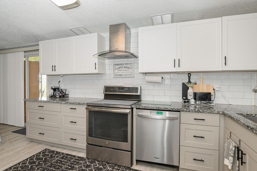 Photo of 8009 Meadowlark Lane, Port Saint Lucie, FL 34952 (MLS # B26026152)