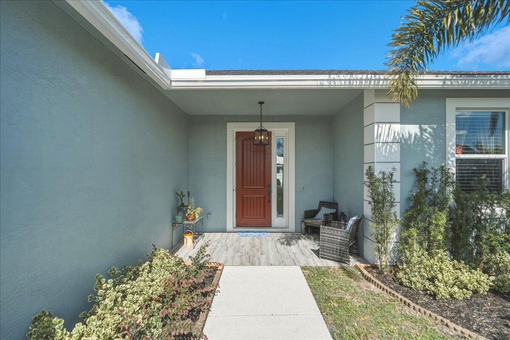 Photo of 2142 SW Pruitt Street, Port Saint Lucie, FL 34953 (MLS # B26041381)
