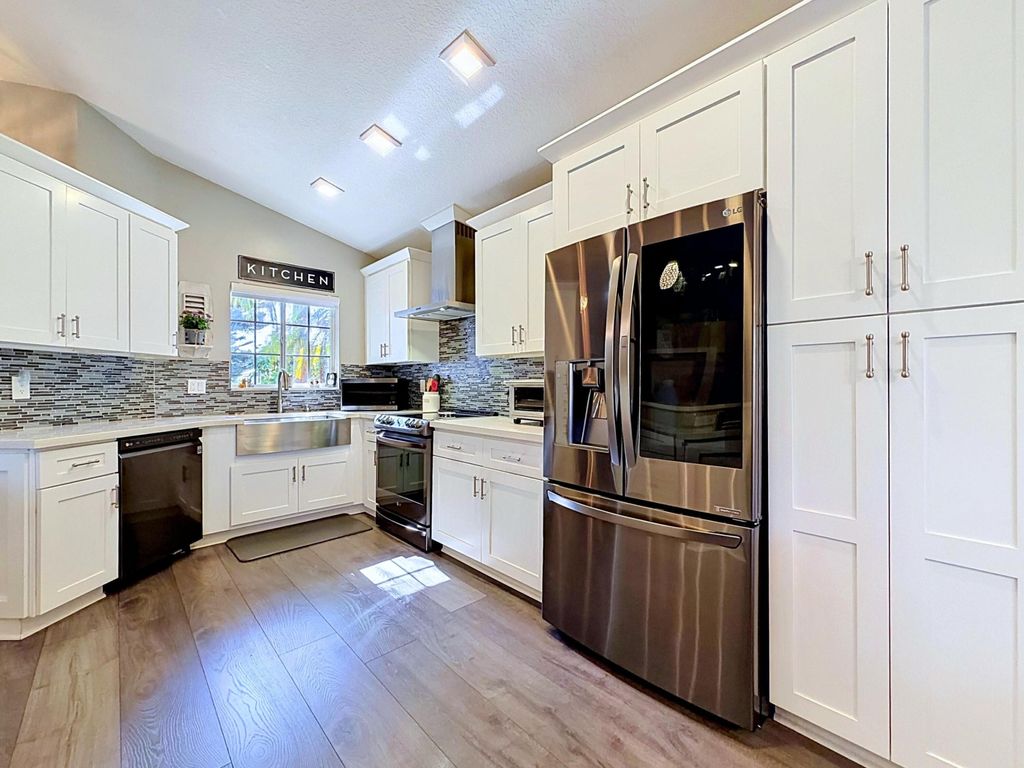 Photo of 333 NW 45th Terrace, Deerfield Beach, FL 33442 (MLS # B26027591)
