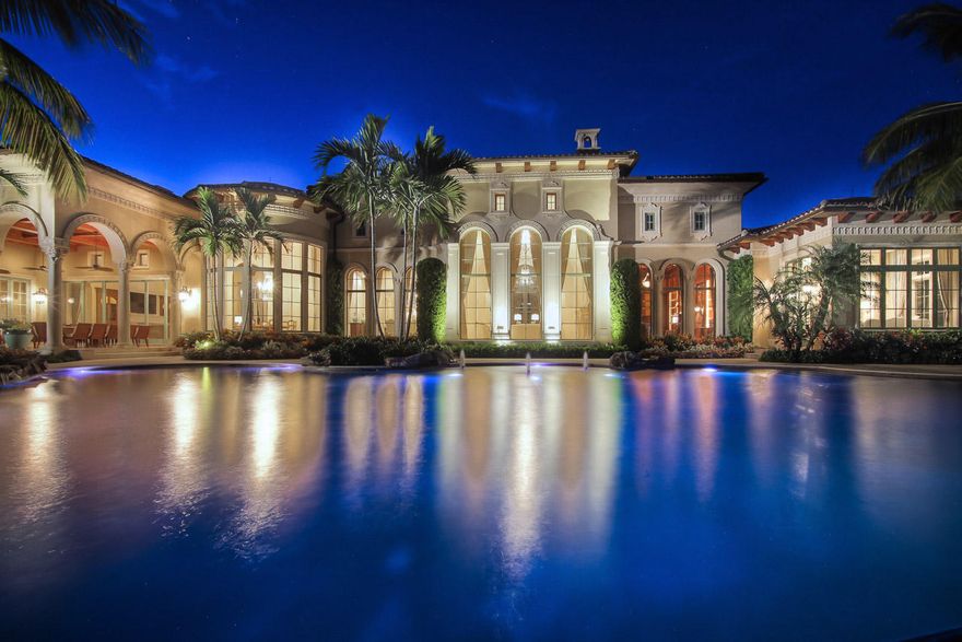 Spectacular Golf Course Estate On The Most Desirable Lot in Old Palm Country Club with water view. This extraordinary 5 bedroom, 6.2 bath home has the finest finishes. Designed to entertain with gourmet chef's kitchen, top of the line appliances, gas range, large walk-in butler's pantry with additional refrigeration and dishwashers. Beautiful wine room compliments the formal dining room which seats 12 or more guests. Formal living room and wood paneled study share a double sided fireplace. This home boasts a media & club room equipped with wet bar, movie room, and billiard table. The Lavish master suite features morning bar, his and her bathrooms, boutique style closets, dressing room, and steam shower. Covered Lanai overlooks resort style pool, private putting green and golf course.