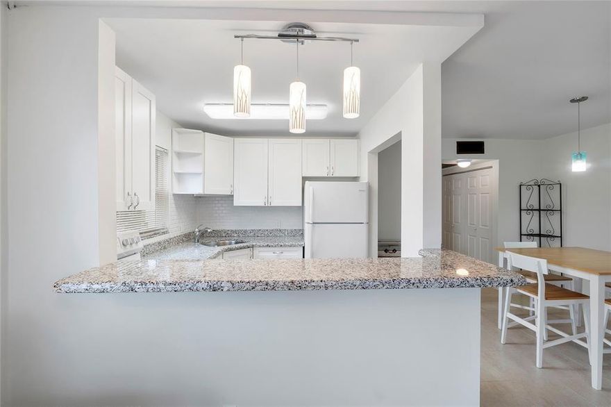 First-floor 1BR/1.5BA corner unit in Century Village's active 55+ community. Features **CENTRAL AIR**, impact windows and doors, updated kitchen and baths, fresh paint, and a peaceful garden-view patio. Corner location offers extra privacy and natural light. Turnkey, furnished, and move-in ready. Conveniently located close to the Le Club Activity Center. This community offers resort-style living with multiple outdoor pools, Olympic-sized indoor pool, recreation and fitness centers, tennis, bocce ball, luxury theater, movies, café, billiards, shuffleboard, classes, sauna, free bus transportation, and more! Tilford R is a cash-only building. Enjoy low-maintenance living in the heart of Deerfield Beach! No Leasing. 700 credit score req. AC & HWH 2016. Roof 2024