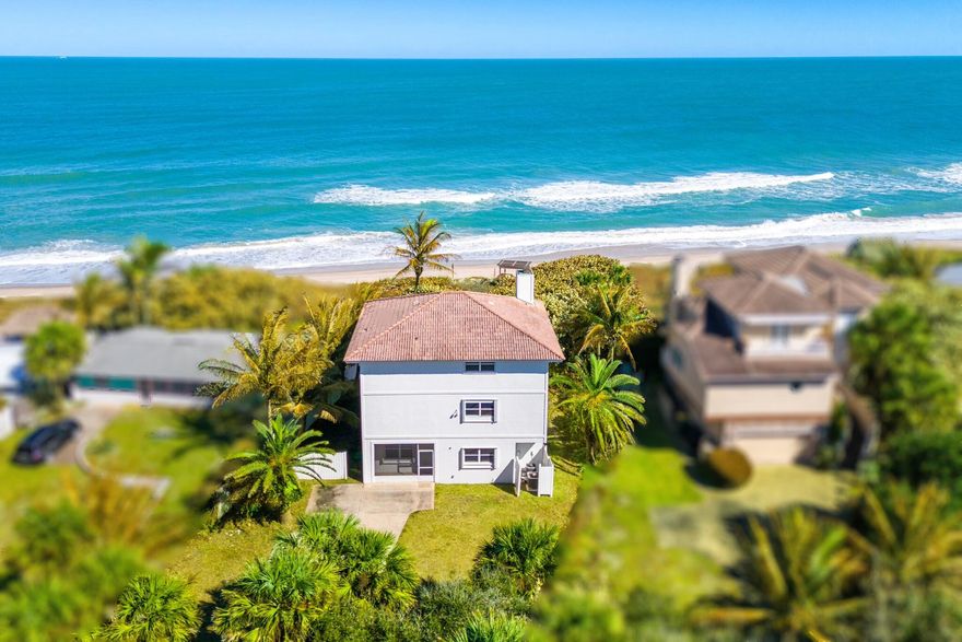 OCEANFRONT- NO HOA- ALL OFFERS ENCOURAGED! Located in desirable south Melbourne Beach, this UPDATED 3-story single-family home, with balconies on the 2nd and 3rd floors, plus an extra room and a finished extra storage room, and 3 full baths, features an open floor plan with multiple living areas, luxury vinyl plank flooring, and an updated kitchen with an island and newer appliances. The primary suite is located on the third floor with a large bathroom, shower, and walk-in closet. An additional bedroom suite is located on the first floor, ideal for guests or flexible living. Exterior features include a large driveway and new shutters throughout. Centrally located near Vero Beach, Cocoa Beach, Viera, the Space Center, Melbourne and Orlando International Airports, Disney World, and more.