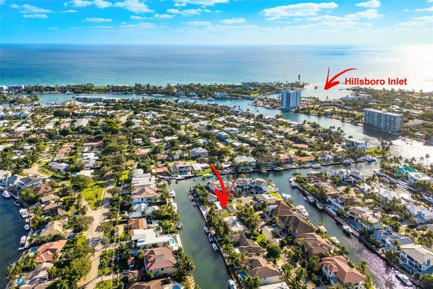 If you're looking for a private street with no through traffic and just one house from the point, then 2443 NE 26th St is a must see!  This home sits on an 10,721 SF lot and boasts 100' of unobstructed waterfront access, no fixed bridges and just minutes away from the inlet and ocean! This spacious 4-bedroom, 3-bathroom home features brand new flooring, updated LED lighting and was just freshly painted.  Additionally, 2 living spaces and the primary suite tucked away from the other 3 bedrooms, makes for optimal privacy. A large 2-car garage and circular driveway provide ample parking and storage. Enjoy the Florida sun in your private pool while the covered patio offers the best in outdoor living! Lighthouse Point is perfectly located to shopping, dining, entertainment and the beach.