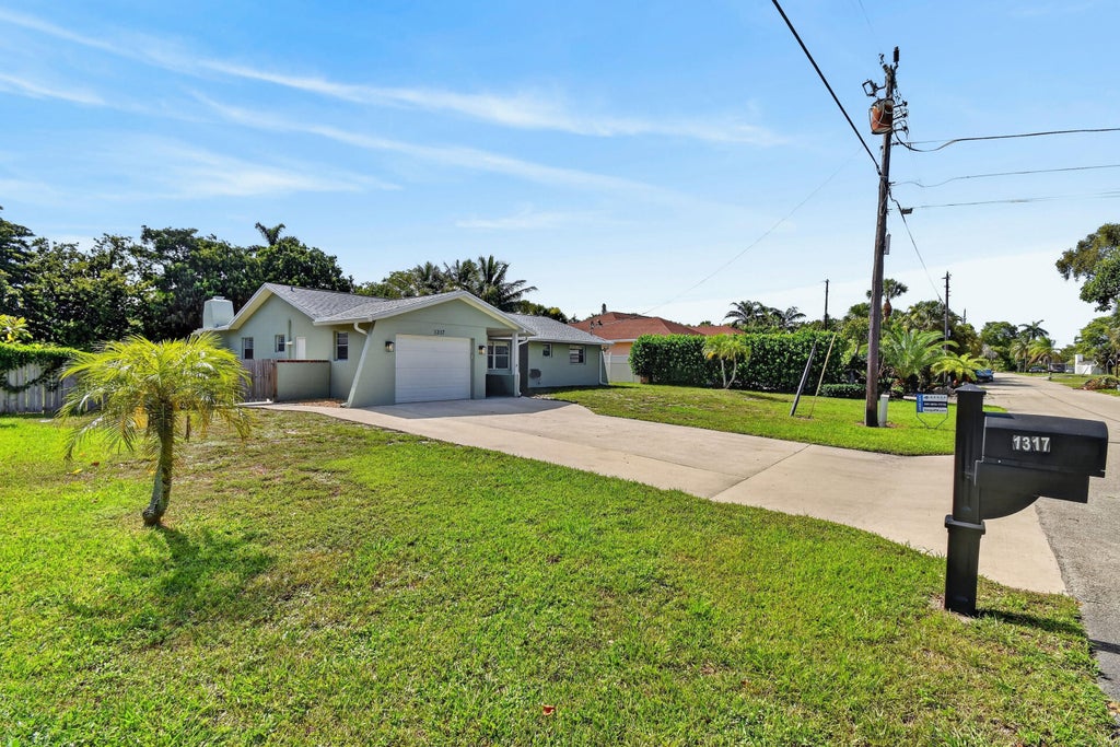 Photo of 1317 Willow Road, West Palm Beach, FL 33406 (MLS # B26036583)