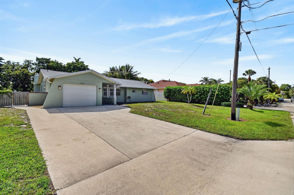 Photo of 1317 Willow Road, West Palm Beach, FL 33406 (MLS # B26036583)