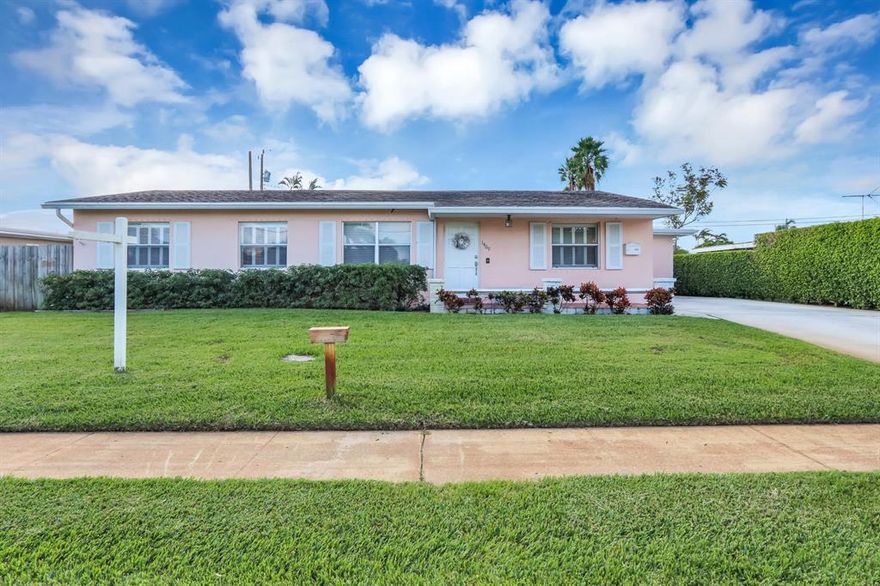 Here is your chance to own a timeless classic! Four bedroom/Two bath CBS pool home in Lake Osborne Estates that boasts over 2200 square feet of living space.  This property has been impeccably maintained and lovingly cared for.  The charm and warmth are enhanced by the bamboo floors in the living area while keeping the classic feel of terrazzo and Herpel stone floors to accommodate old Florida style.  The spacious all white kitchen overlooks the large Florida room with gorgeous views of the 14x28 pool and tropical set deck and landscaped yard.  On the technical side the home features full hurricane protection, a high end Lennox 23 seer HVAC system with UV light, Extra refrigerator in laundry,  2008 roof, a deluxe storage shed, and PGT windows.  This property is unique and has it all!