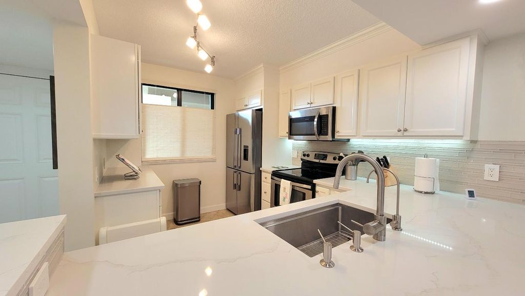 Photo of 701 S Seas Drive #104, Jupiter, FL 33477 (MLS # R11046926)