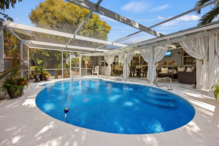 Beautiful 3BR/2BA CBS home with NO HOA—perfect as a primary residence, vacation home, or Airbnb/investment property with immediate rental potential! Recent updates include a new roof (2025) and gas tankless water heater (2022). Enjoy South Florida living with a screened-in pool, lush manicured landscaping, irrigation system, outdoor shower, shed, and side backyard access, including private side entry to one bedroom—ideal for guests or added flexibility. Backyard furniture and camera system included! Prime location less than 1 mile to Lake Worth Beach Golf Club and vibrant Downtown Lake Worth Beach, 2 miles to the beach and Benny's on the Beach, plus easy access to I-95 just 1.3 miles away.