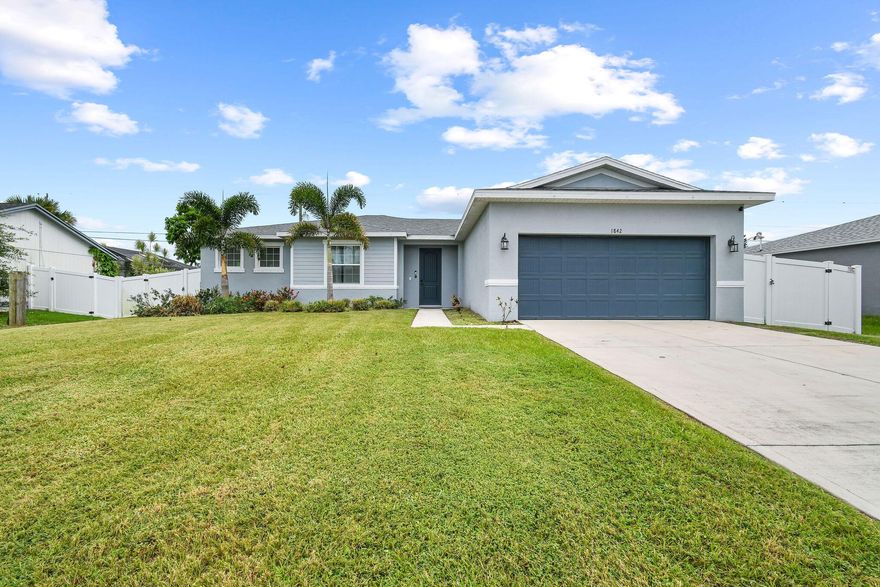 2022 built, CBS home beautifully designed Seaside Model by Carharp offers 4 Beds, 2 Baths & 1,775 sf. of living space w/an over-sized 2-car garage in a quiet neighborhood with NO HOA!  As you enter this home you are greeted w/9'4'' ceilings, 8' doors, wood plank tile in the main areas & 5 1/4 '' baseboards throughout. Modern chef's kitchen features beautiful island w/breakfast bar, 42'' white staggered shaker-style cabinets, granite countertops w/4'' backsplash & Samsung SS appliances. Spacious open-concept layout offering tons of natural lighting throughout & functional flow.  The primary suite is spacious w/his & hers closets while the mstr. bath features his & hers sinks, spa-inspired walk-in shower w/ frameless glass doors & stylish listello trim.  Newly installed over-sized tiled &