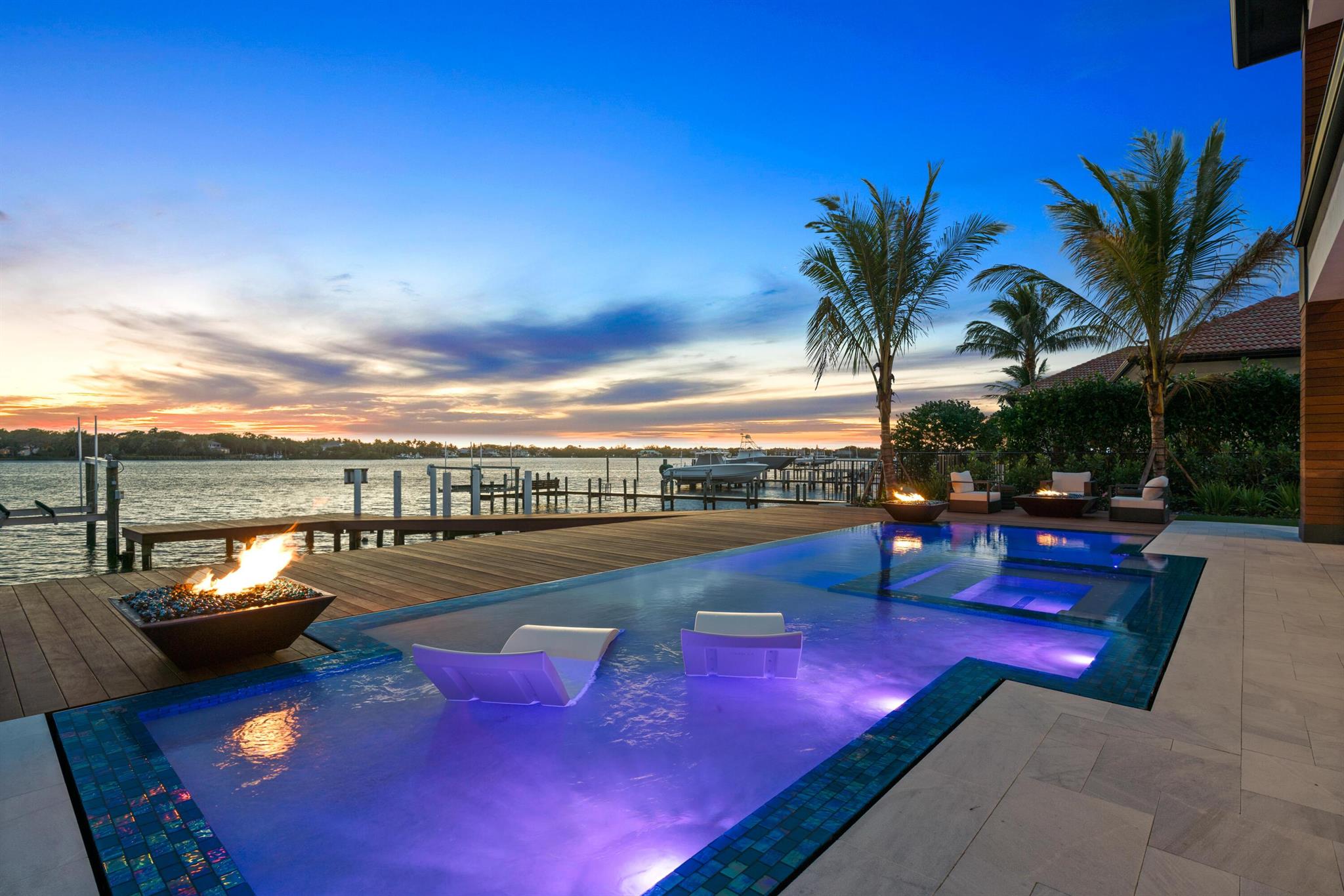 Brand new direct Intracoastal estate on prime Hypoluxo Island, set for Q1 2026 completion. Walk to the beach, Eau Resort & Spa, and top-tier dining. Just 1.5 miles to I-95 and minutes to PBI and private jet access. Deep-water, no-wake zone ideal for large yachts and sportfishing boats. Entirely new construction including seawall, with ultra-luxury finishes, smart/green technology, and top energy efficiency throughout. Resort-style pool with infinity edge, waterfall pergola, and fire features--no expense spared. Call for more details. Pictures are of previous model that was finished.
