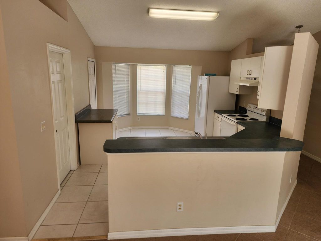 Photo of 1442 SW Abacus Avenue, Port Saint Lucie, FL 34953 (MLS # R10925456)