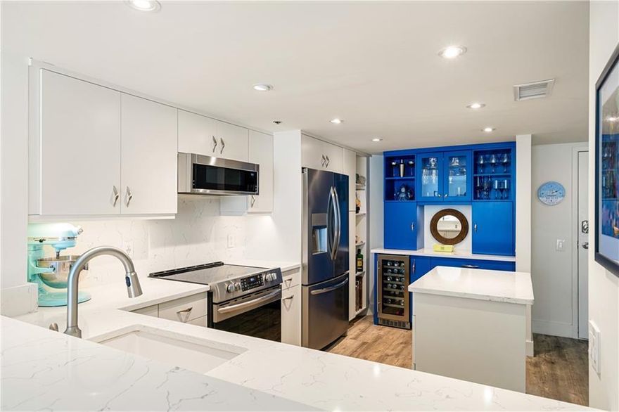 Experience coastal luxury at its finest in this totally renovated Aquanique condo on Hutchinson Island! Enjoy gorgeous ocean views and an open, airy floor plan with elegant finishes throughout. The gourmet kitchen shines with stainless steel appliances, island, quartz countertops, wine/coffee bar, pantry, & glass cabinetry. The primary suite features a walk-in closet & spa-style bath w/ double sinks, quartz countertops & large walk-in shower. The recently renovated building has a new roof. Resort-style amenities: pool, spa, fitness, pickleball, & beach access. This is island living redefined!