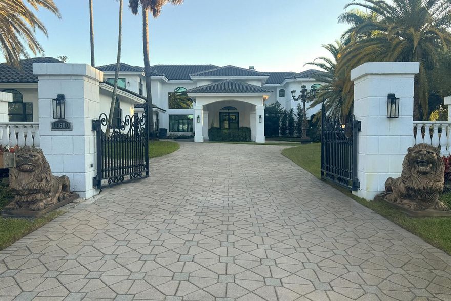 Beautifully reimagined & completely redone Interior, this 1.14-acre estate in the exclusive guard-gated community of Fieldbrook Estates blends timeless elegance with modern luxury. A grand tropical drive lined with Royal and Canary palms leads to a dramatic portico and soaring double-door entry opening to a magnificent foyer with a sweeping dual staircase. Expanded & enhanced throughout, 9BD & 8.2BA with exquisite finishes, custom ceilings, crown molding, state-of -the-art Home theatre, Gym, Sauna & a gourmet chef's kitchen with top-tier appliances. The spacious layout includes multiple living areas plus a beautifully finished 2-bedroom guest house with full kitchen, office, private driveway, & separate entrance. Minutes to A-rated schools, beaches, shopping, & fine dining, & airports--