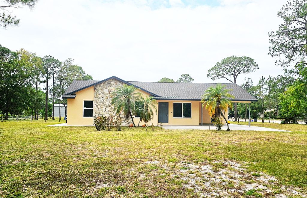 Photo of 13830 62nd Court N, West Palm Beach, FL 33412 (MLS # R10983027)