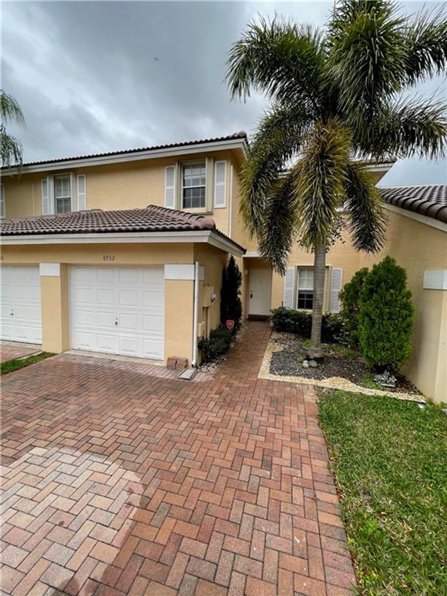 Beautifully renovated, 3 Bedroom 2.5 bath, Townhome with a lake view. New floors on 1st floor with open kitchen and wood floors on second floor/stairs. Single car garage with huge driveway. Tradewinds is a gated community with a pool. Special Assessment on roof.