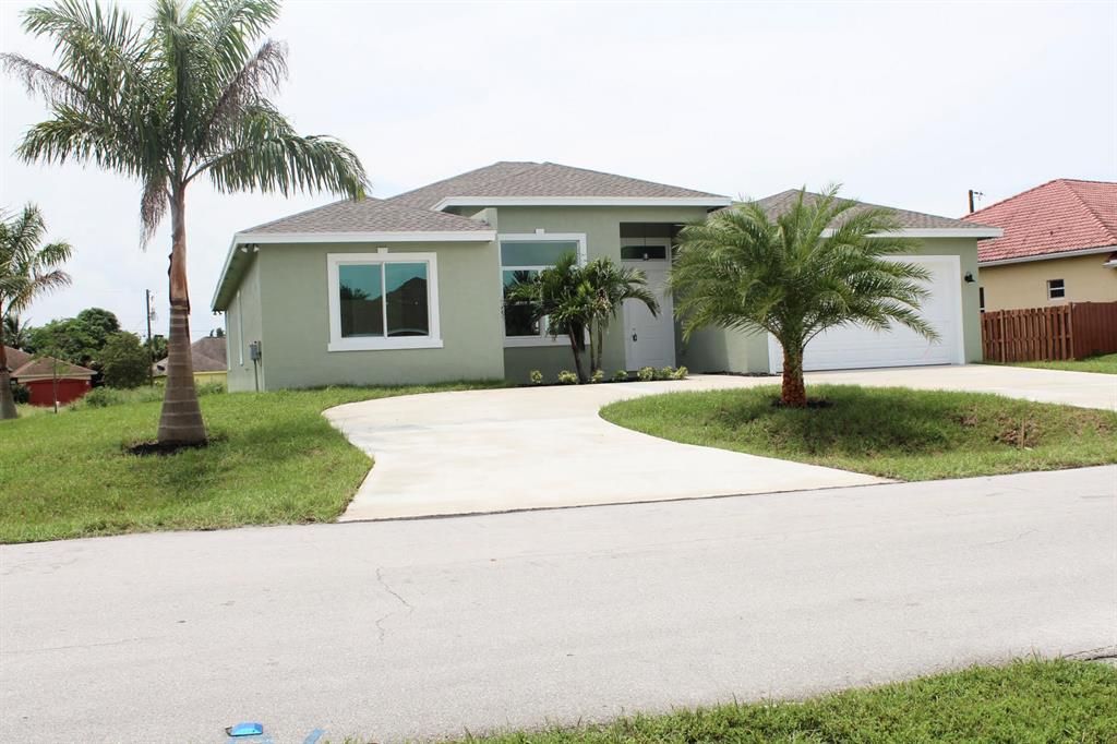Photo of 902 SW Mcelroy Avenue, Port Saint Lucie, FL 34953 (MLS # R10735923)