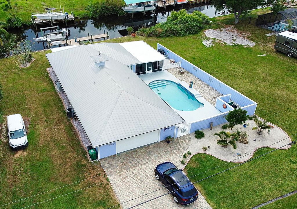 Photo of 744 SE Seahouse Drive, Port Saint Lucie, FL 34984 (MLS # R10788840)