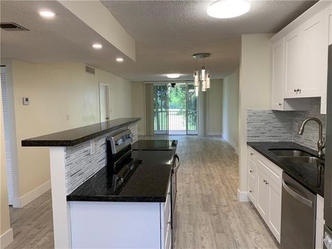 Photo of 250 Jacaranda Drive #203, Plantation, FL 33324 (MLS # F10551881)