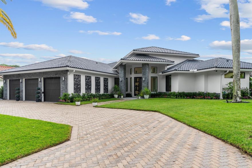 Welcome home! This stunning, well-planned home has a flexible, open floor plan and has been redone to the highest standards with top-of-the-line fixtures/finishes and impact doors/windows throughout. Located in highly sought after Bermuda Run which is walking distance to Broken Sounds main club house. Boasting over 4,700 sqft this 5 bedroom, 4 bath, 3 car garage + movie theater, bonus room and gym have been remodeled to perfection. The light & bright foyer welcomes you to a relaxing great room and a beautifully finished kitchen. Relax in your primary suite with custom set tile & his/her custom closets. The master bath has a perfect spa-like feel including, free standing soaking tub and an open shower.