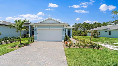 Photo of 204 SE Via Sangro, Port Saint Lucie, FL 34952 (MLS # F10538901)