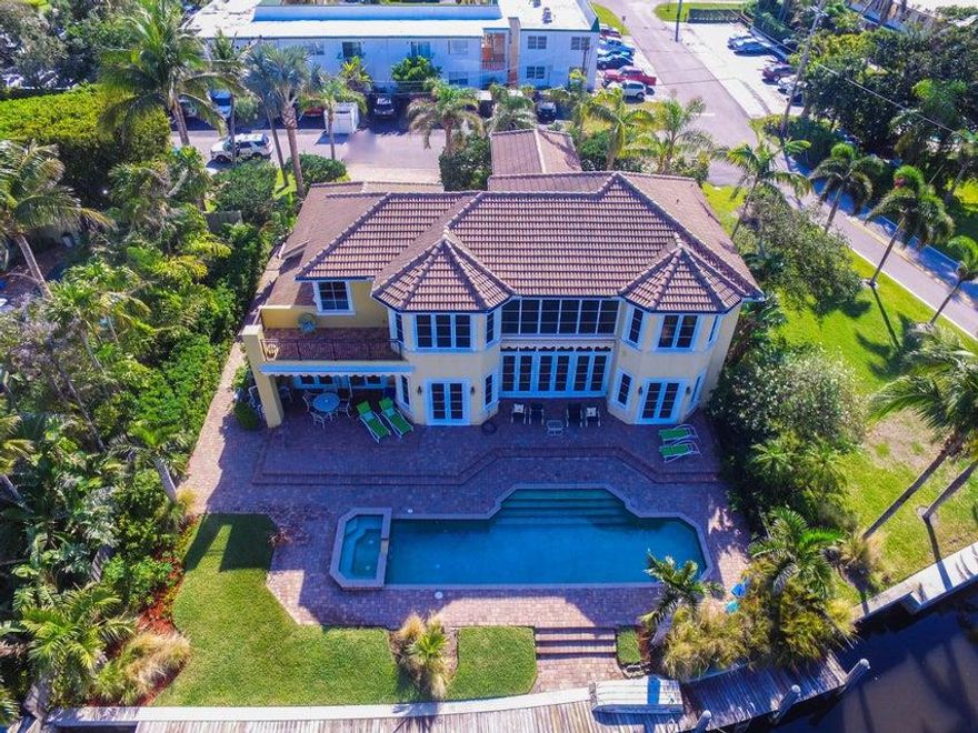 A SHORT DISTANCE FROM THE OCEAN, THIS COMPLETLY CUSTOME MEDITERRANEAN GEM FEATURES BEAUTIFUL MARBLE, POLISHEDHARDWOOD FLOORING, SOARING CEILINGS, A 20' HIGH STONE FIREPLACE, CHEF'S KITCHEN WITH CHERRY CABINETRY, GRANITE COUNTERS AND TOP OF THE LINE STAINLESS APPLIANCES. LUXURY MARBLE & STONE ARE FEATURED IN EACH BATHROOM PLUS CUSTOM CROWN MOLDINGS AND BUILT -INS ARE LOCATED THROUGHOUT. ALL DOORS AND WINDOWS ARE IMPACT RATED AND ALLOW FOR FABULOUS VIEWS OF THE SPANISH RIVER LAGOON AND NATURE PRESERVE. OUTDOOR AMENITIES INCLUDE A 40' POOL WITH SPA, AND 80' BOAT DOCK WITH LIFT, ONLY MINUTES FROM THE BOYNTON INLET AND BEAUTIFUL ATLANTIC OCEAN. A PLEASURE TO SHOW. LIFT IN GARAGE FOR THIRD CAR. OPTION FOR NEIGBORHOOD MEMBERSHIP IN THE MCCORMICK MILE BEACH CLUB W/BEACH ACCESS.