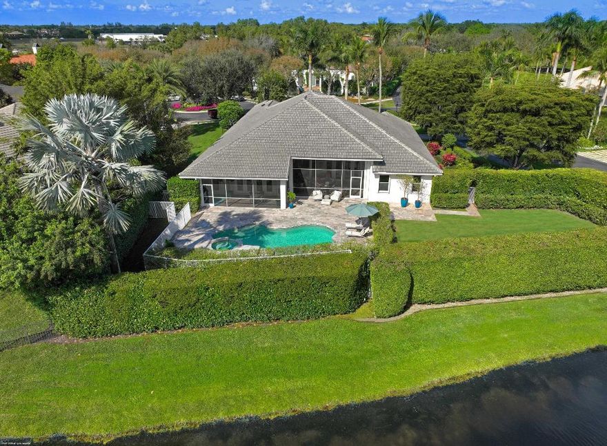 Stunning corner lot in The Equestrian Club Estates. Experience the ultimate in equestrian living. Exceptional 3bedroom/3.1bathroom with 3 car garage. Situated on approximately 0.6 acres just steps away from the Palm Beach International Equestrian Center.

The grand entrance features a picturesque circular driveway, setting the tone for the beautiful gardens and lush landscaping that surround the property. 

Inside, discover a split floor plan with a private master wing, complete with his and hers closets, dual sinks, and a luxurious dual-entry shower. Two additional bedrooms and two bathrooms are tucked away in a separate wing, perfect for guests or family members.

Enjoy the high-quality finishes, including marble and wood flooring, a wood-paneled office with custom Murphy bed, formal living and dining areas, and a spacious family room off the kitchen. Perfect for entertaining! 

Unwind in one of two screened outdoor seating areas. One features a relaxing lanai, while the other boasts a summer kitchen and dining table. The lush landscaping includes ample grass areas, filling the home with sunlight. 

This magnificent estate is the ultimate horse show home, offering convenience, luxury, and the perfect blend of elegance and equestrian lifestyle. 

DISCLAIMER: All information provided to you regarding this Property by the realtor and her associates has been obtained from third parties such as the Multiple Listing Service,
public records and other sources. All Buyers should independently verify all information provided regarding this Property. The Seller, Realtor and Listing broker make no representation as to the accuracy of this information.