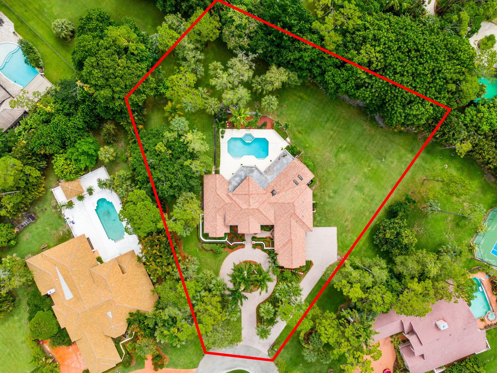 Private Whispering Woods Estate on Over an AcreWelcome to 5285 E Leitner Drive, a 4-bedroom + office, 4.5-bath estate in the exclusive, guard-gated community of Whispering Woods. Tucked behind two gated entrances at the end of a quiet cul-de-sac, this property sits on over an acre of lush, private land with beautiful green views from nearly every room.The well-designed split floor plan features a spacious primary suite, a dedicated office, and generously sized bedrooms. A light-filled family room with a built-in wet bar opens to the backyard, ideal for entertaining. The expansive kitchen flows seamlessly into the main living areas, making hosting effortless.Outside, a resort-style pool and spa are surrounded by mature landscaping and open green space, perfect for relaxing or