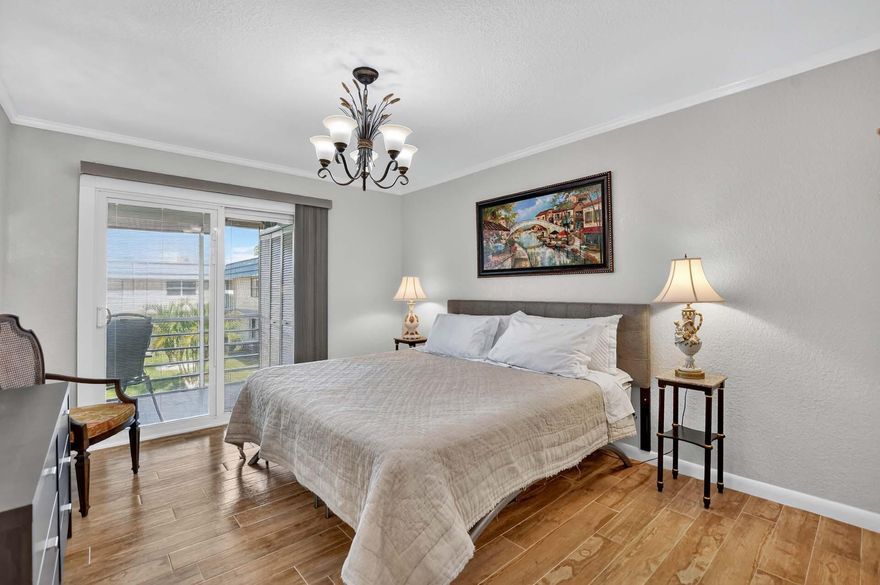 Kings Point's most uniquely updated condo. This beautiful 2-bedroom home features a stylish island kitchen with modern finishes and a well thought-out renovation that created a true en suite bedroom with sliders opening to a private balcony overlooking peaceful garden views. Other features include custom doors, a tankless water heater (2022), and AC (2015). Experience resort-style living with 3 clubhouses, 2 golf courses, bistro & café, salon, heated indoor/outdoor pools, lap & resistance pools, tennis, fitness center, theater, arts & crafts, billiards, and a courtesy bus service--all just minutes to vibrant Atlantic Ave and the beach!