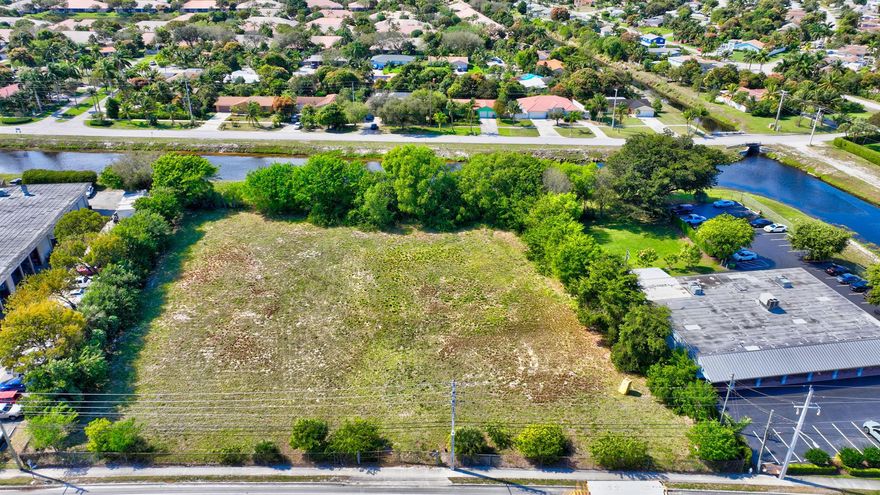 LOCATED JUST 2 BLOCKS NORTH OF ATLANTIC AVENUE ON THE WEST SIDE OF CONGRESS AVENUE. THIS 2.023 ACRE FENCED LOT IS READY FOR YOUR NEW BUSINESS. PROPERTY HAS BEEN DE MUCKED AND FILLED AND HAS A MEDIAN CUT OUT FOR EASY ACCESS OF NORTH OR SOUTH BOUND TRAFFIC.