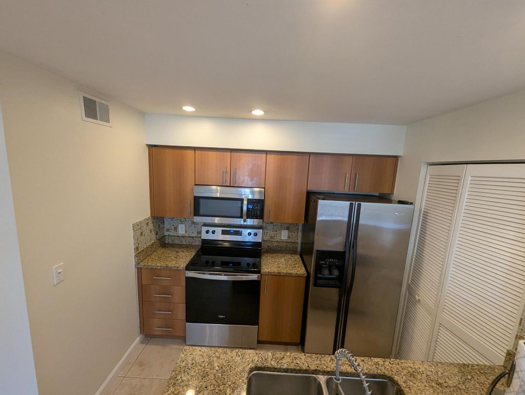 Photo of 1335 Crystal Way #E, Delray Beach, FL 33444 (MLS # B26032583)