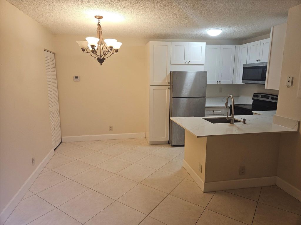 Photo of 731 Lyons Road #16108, Coconut Creek, FL 33063 (MLS # F10525095)