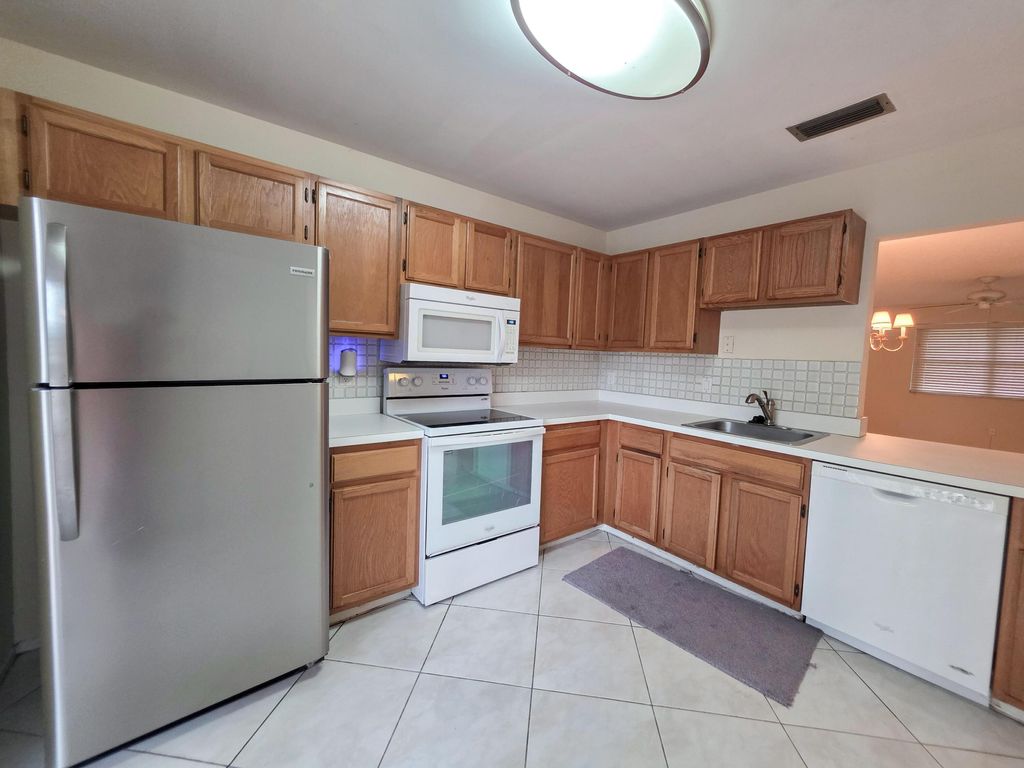 Photo of 103 Rose Bay Court, Royal Palm Beach, FL 33411 (MLS # R11163699)