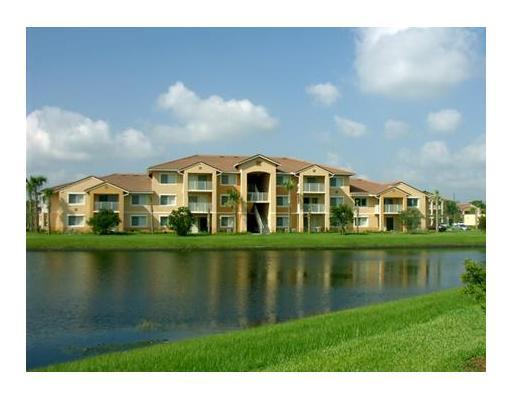 Spacious one bedroom one bath condo all tile floors overlooking lake, and clubhouse pool on third floor private, extra storage, gated community, with pool, tennis and clubhouse close to restaurants, shopping, and great for commuters, one mile from I-95