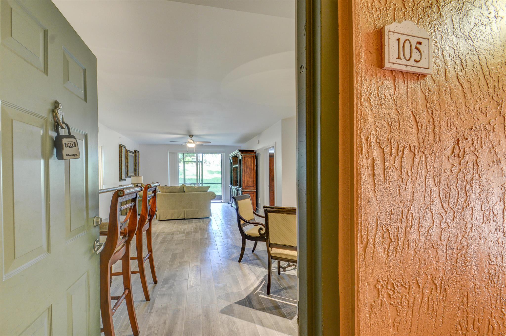 Fantastic turnkey furnished property available for rent OFF-SEASON at $1,985/mth, Annually at $3000/mth, or Seasonally at $4,800/mth. This 2bdrm/2ba ground floor unit is comfortably outfitted for your stay! Nicely upgraded with wood looking tile throughout, large capacity washer/dryer, stainless steel appliances, and updated bathrooms. This condo includes a screened and covered patio and the convenience of a one car garage with an extra deep driveway. Note: Improvements in decor have been made!--Large tv wall unit and heavy style artwork has been removed. White linens added in primary bedroom.