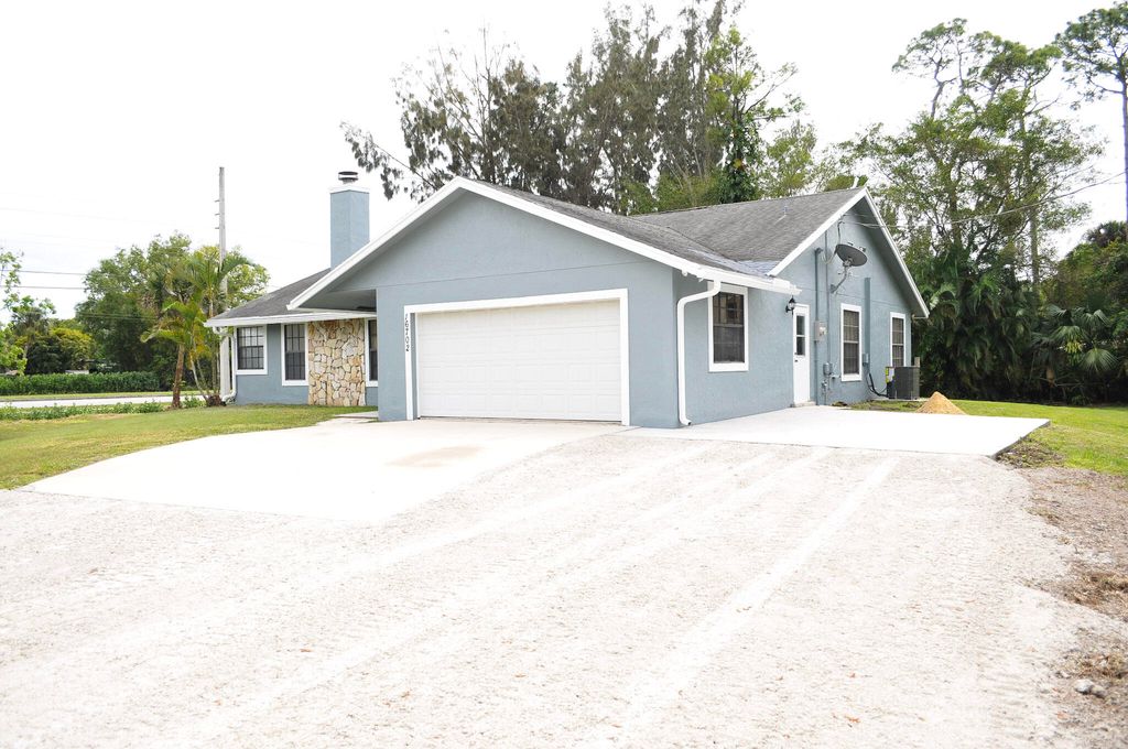 Photo of 16702 E Calder Drive, Loxahatchee, FL 33470 (MLS # R10958685)