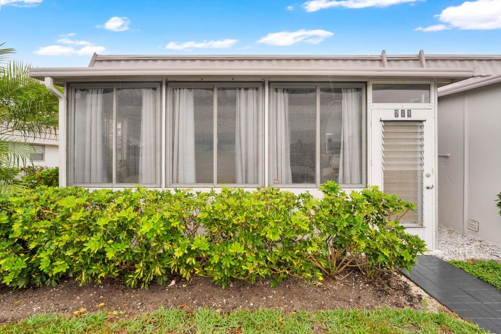 Photo of 211 Valencia Cir, Delray Beach, FL 33446 (MLS # B26022975)