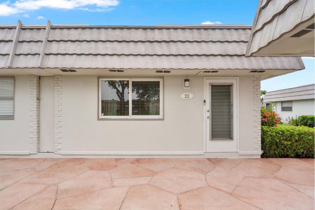 Photo of 211 Valencia Cir, Delray Beach, FL 33446 (MLS # B26022975)