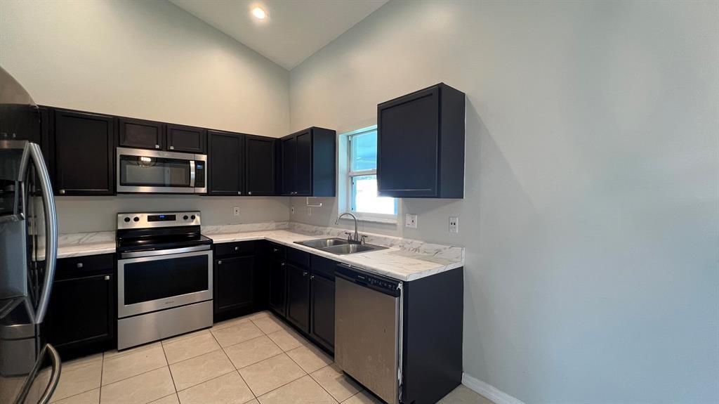Photo of 1850 SW Effland Avenue, Port Saint Lucie, FL 34953 (MLS # F10447309)