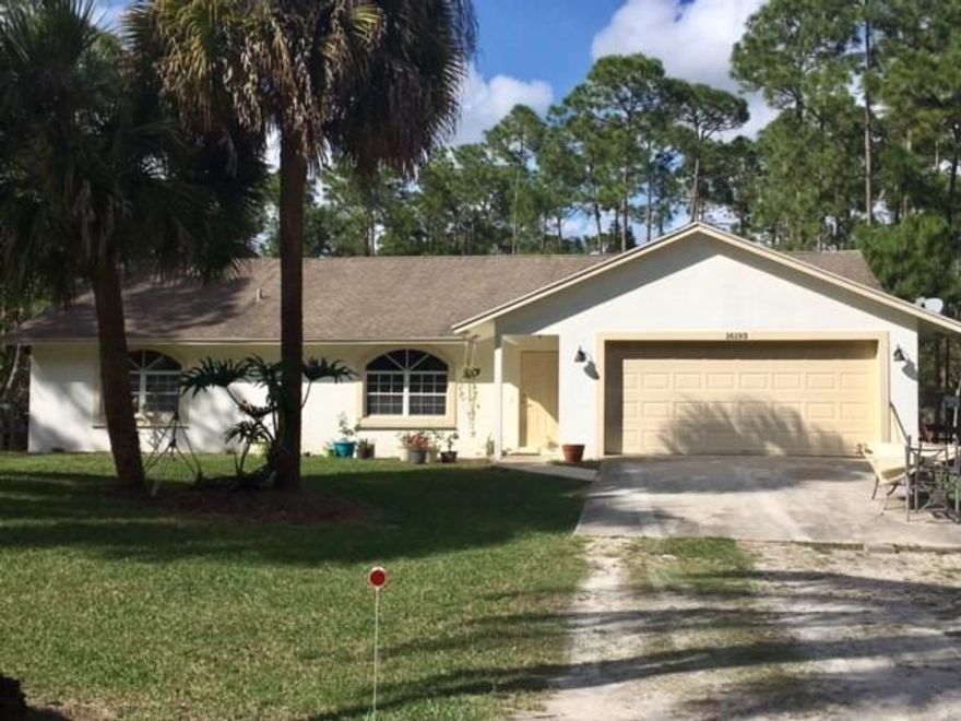 This 3 bedroom/2 bathroom home situated on 1.15 acres will provide you with the serene, peaceful living enjoyed by many.  Located just off Seminole Pratt Road, this property is easy to access to all major shopping and events. The split floor plan is perfect for a family to enjoy their privacy but also has a large family room for entertaining.  This is a must see.  Will not last long!