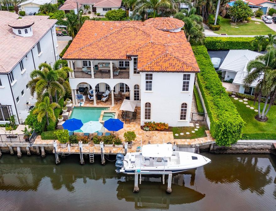 Just steps from the ocean, a highlight of this handsome estate is its prime East Delray Beach location on a beautifully landscaped property with 75 +/- feet along a deep-water finger of the Intracoastal Waterway canal with a dock and boat lift. The lavish residence features luxurious indoor and outdoor living spaces that seamlessly combine to create a striking a balance between elegance, openness and warmth. Master Bedroom Chandelier is excluded. The information herein is deemed reliable and subject to errors, omissions or changes without notice.  The information has been derived from architectural plans or county records. Buyer should verify all measurements. LOCATION

1040 Lewis Cove Road, Delray Beach, Florida: Just off A1A on a cul de sac street in the sought-after Seagate area in East Delray Beach, this waterfront estate is just a few blocks from the prestigious Seagate Beach Club as well as the City's pristine award-winning beaches. This established neighborhood is also just a short drive to Downtown Delray Beach's vibrant Atlantic Avenue, with its array of arts and entertainment offerings interspersed with fine-dining establishments, cafés and bars.

PROPERTY 
 
A brick-paved drive, shaded by Royal Palms, circles around a  tropically landscaped island delivering a beautiful sense of arrival, and in the fenced backyard, a covered loggia, with a summer kitchen and gas grill, overlooks the pool with a spill-over spa. Offering incomparable waterfront living with 75+/- feet along a deep-water finger of the Intracoastal Waterway and running the full length of the property is a concrete  dock with lighted posts and a boat lift that can accommodate a 12,000+/- pound vessel.

RESIDENCE 

Striking the perfect balance between elegance, openness and warmth, this regal five-bedroom Mediterranean-style estate, with 6,812 +/- total square feet, was astutely designed with a well-conceived floor plan maximizing breathtaking water views and a seamless indoor/outdoor flow for grand entertaining. Masterfully crafted decorator details include rich Jerusalem-stone and honey-toned hardwood flooring, custom Venetian plaster finishes, and soaring 12-foot ceilings. Introducing this classic architectural gem is a 24-foot-high turreted foyer, featuring inset onyx, lighted alcoves for art display, and a graceful wrought-iron-embellished stairway. Just beyond, through a columned archway, is the gracious living room, with details that include a beamed ceiling, a gas fireplace with an impressive carved coral-rock mantel, and  two sets of arched French doors that open to the poolside loggia. The dining room, also accessed from the foyer via a wide archway, features a gated wine larder, and off the living room is the pool-view custom-fitted library with an ensuite bathroom that serves as a cabana bath. In a separate pool-view wing, informal living is celebrated. Here, the gourmet kitchen, finished with high-end appliances, custom wood cabinets, granite counters, stone backsplashes, two islands and pantry, serves the breakfast alcove and family room. Upstairs, the master suite and two guest suites open to the water-view balcony. The opulent master suite, featuring wood flooring, beadboard ceiling, and morning bar, includes custom-fitted closets and a spa-inspired granite-embellished bathroom. Two additional ensuite garden-view guest bedrooms, laundry room and three-car garage complete the layout, while fine amenities include an elevator, 12-camera security and Creston systems, full-house generator, and phantom screens.

DISCLAIMER: Information published or otherwise provided by the listing company and its representatives including but not limited to prices, measurements, square footages, lot sizes, calculations, statistics, and videos are deemed reliable but are not guaranteed and are subject to errors, omissions or changes without notice. All such information should be independently verified by any prospective purchaser or seller. Parties should perform their own due diligence to verify such information prior to a sale or listing. Listing company expressly disclaims any warranty or representation regarding such information. Prices published are either list price, sold price, and/or last asking price. The listing company participates in the Multiple Listing Service and IDX. The properties published as listed and sold are not necessarily exclusive to listing company and may be listed or have sold with other members of the Multiple Listing Service. Transactions where listing company represented both buyers and sellers are calculated as two sales. The listing company's marketplace is all of the following: Vero Beach, Town of Orchid, Indian River Shores, Town of Palm Beach, West Palm Beach, Manalapan Beach, Point Manalapan, Hypoluxo Island, Ocean Ridge, Gulf Stream, Delray Beach, Highland Beach, Boca Raton, East Deerfield Beach, Hillsboro Beach, Hillsboro Shores, East Pompano Beach, Lighthouse Point, Sea Ranch Lakes and Fort Lauderdale. Cooperating brokers are advised that in the event of a Buyer default, no commission will be paid to a cooperating Broker on the Deposits retained by the Seller. No commissions are paid to any cooperating broker until title passes or upon actual commencement of a lease. Some affiliations may not be applicable to certain geographic areas. If your property is currently listed with another broker, please disregard any solicitation for services. Copyright 2021 listing company All Rights Reserved