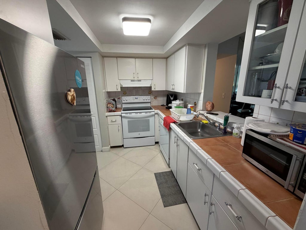 Photo of 7380 NW 18th Street #203, Margate, FL 33063 (MLS # B26040990)