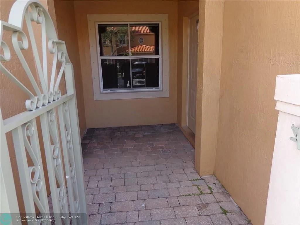 LUXURY LIVING IN THE GATED COMMUNITY OF THE VILLAS AT HARBOR ISLES. SPACIOUS AND COZY 3 BEDROOM, 3 BATH TOWNHOUSE WHICH OFFERS AN OPEN FLOOR PLAN. MODERN KITCHEN WITH GRANITE COUNTERTOPS. LOCATED CLOSE TO BEACHES, AIRPORT, I-95, SHOPPING, RESTAURANTS, AND MUCH MORE. EASY ACCESS VOTH NORTH AND SOUTH. THIS PROPERTY HAS CERAMIC TILE THRU-OUT THE ENTIRE 1ST FLOOR, AND LAMINATED CHERRY FINISH FLOORING ON THE SECOND FLOOR. NEW STAINLESS STEEL DOUBLE RANGE, MICROWAVE, NEW DISHWASHER, WASHER AND DRYER. SERENE AND PEACEFUL LAKE VIEWS FROM THE PATIO. COMMUNITY OFFERS A POOL, HOT TUB, PLAYGROUNDS, AND 24 HOUR SECURITY. UPSTAIRS OFFERS A MASTER SUITE AND A GUEST SUITE. HURRICANE SHUTTERS, 2 PARKING SPACES.