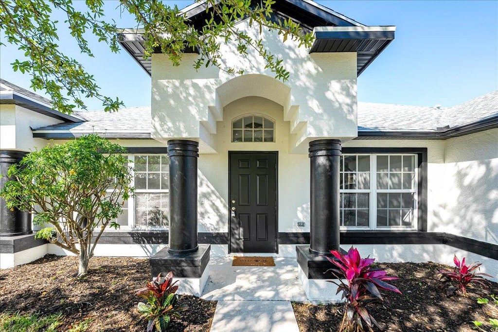 Photo of 1525 SW Leisure Lane, Port Saint Lucie, FL 34953 (MLS # R11070866)