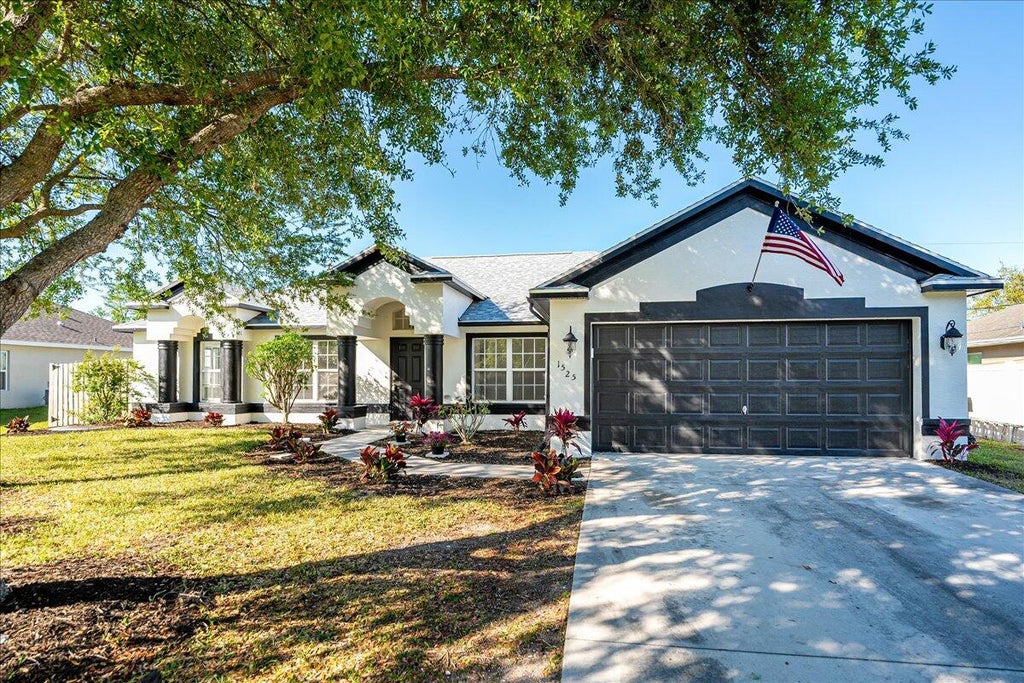 Photo of 1525 SW Leisure Lane, Port Saint Lucie, FL 34953 (MLS # R11070866)