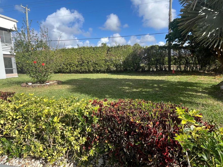 Private 2nd floor TRUE CORNER unit facing a garden view from your upstairs porch. Nice neutral colored tiling on a diagonal throughout.