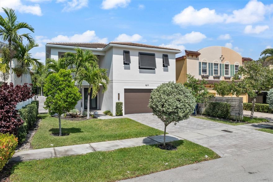 Located in the heart of Victoria Park, this stunning 4-bedroom + office, 4-bath home offers over 3,300 sq. ft. of luxurious living space. Designed with an open-concept layout and filled with natural light, it features a chef’s kitchen with KitchenAid appliances, a gas cooktop, and quartz countertops. The second-floor primary suite boasts a walk-in closet, private balcony, and spa-like bath with dual vanities, a large shower, and a soaking tub. Additional highlights include spacious secondary bedrooms, a wet bar, and a generous 2-car garage w/ epoxy coating. Step outside to a beautifully landscaped backyard with a pool, sun shelf, and large covered patio—perfect for entertaining. Just minutes from Fort Lauderdale Beach, Las Olas, shopping, and dining!