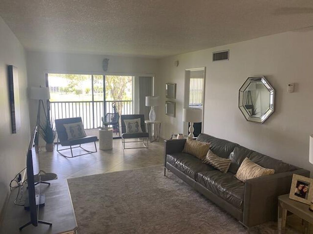 Photo of 12829 Briarlake Drive #204, Palm Beach Gardens, FL 33418 (MLS # R10818818)